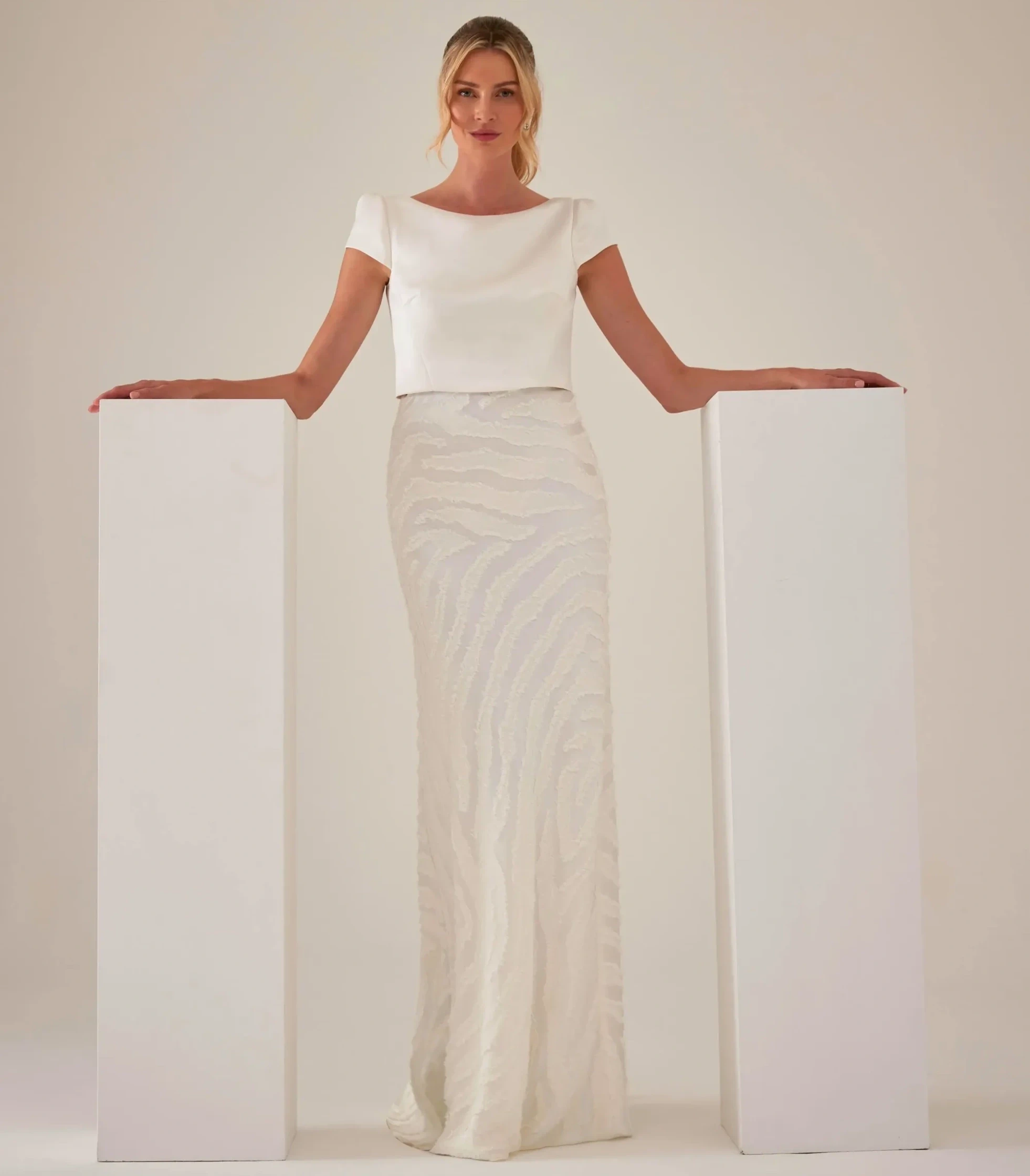 Model wearing a gown by Sassi Holford