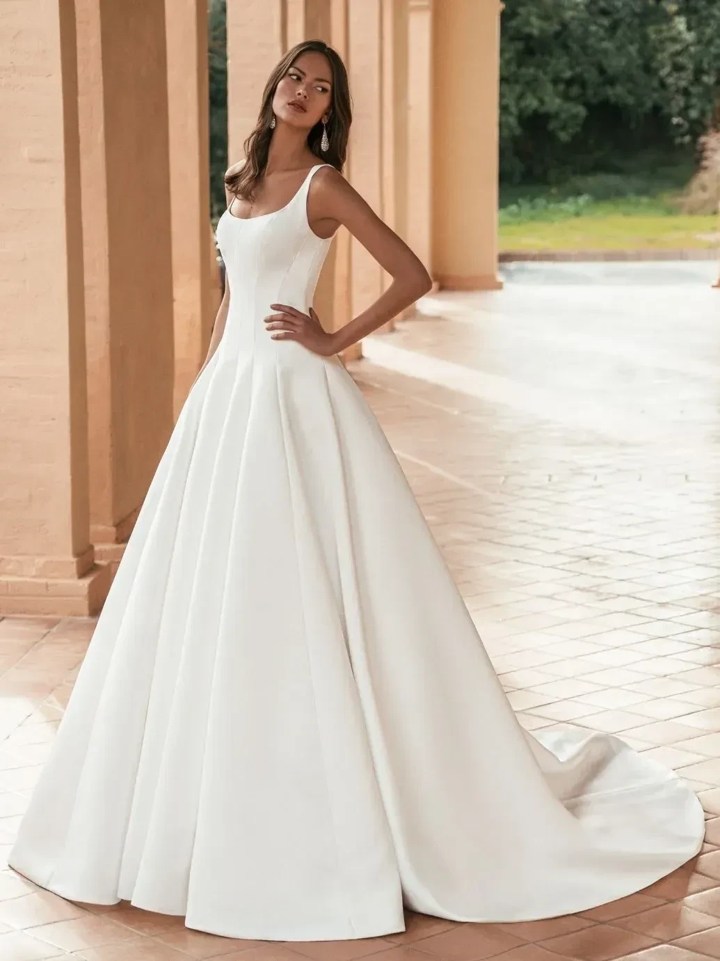 Model wearing a gown by Blue by Enzoani