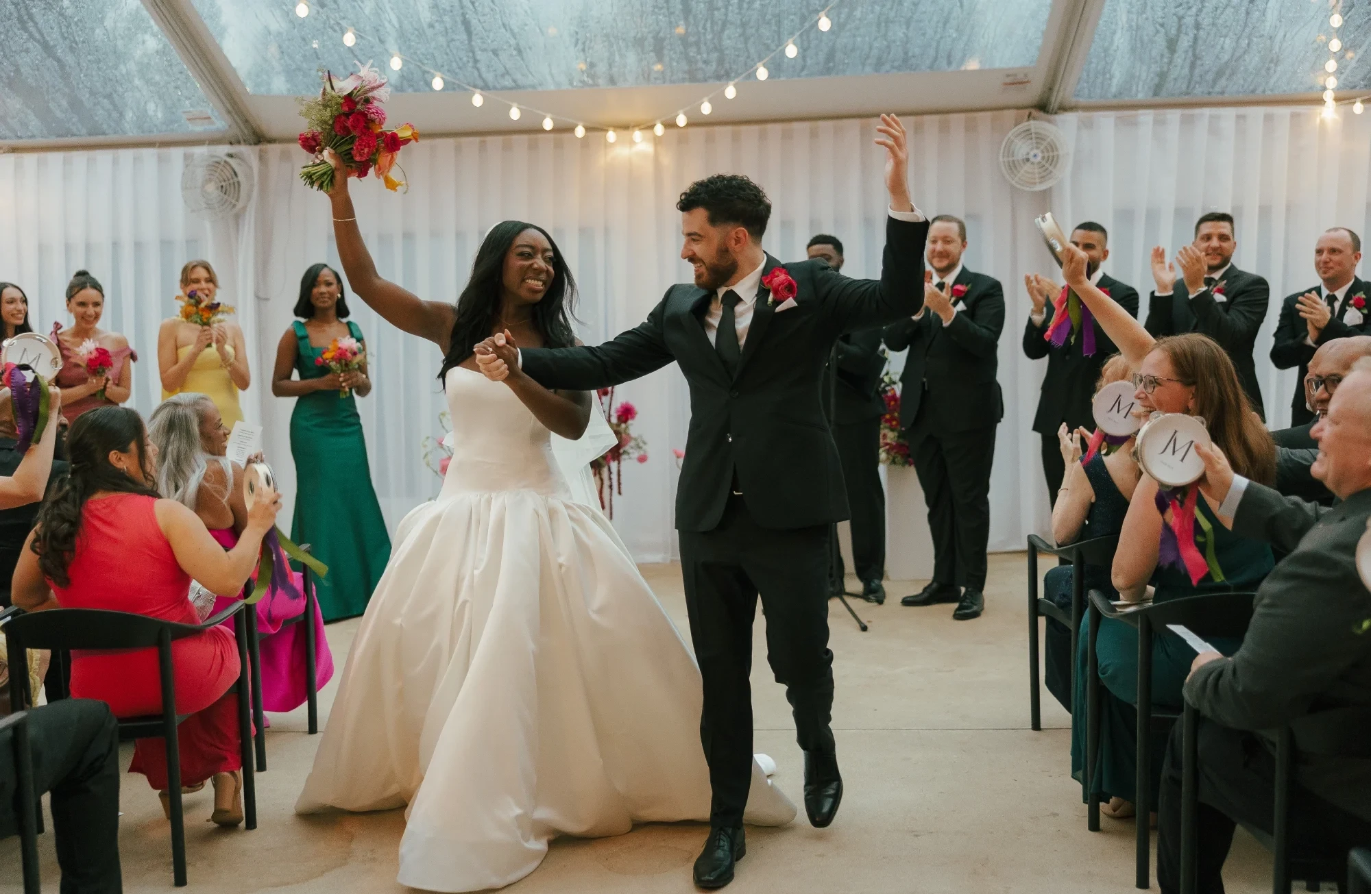 Сouple wearing a white gown and a gray suit