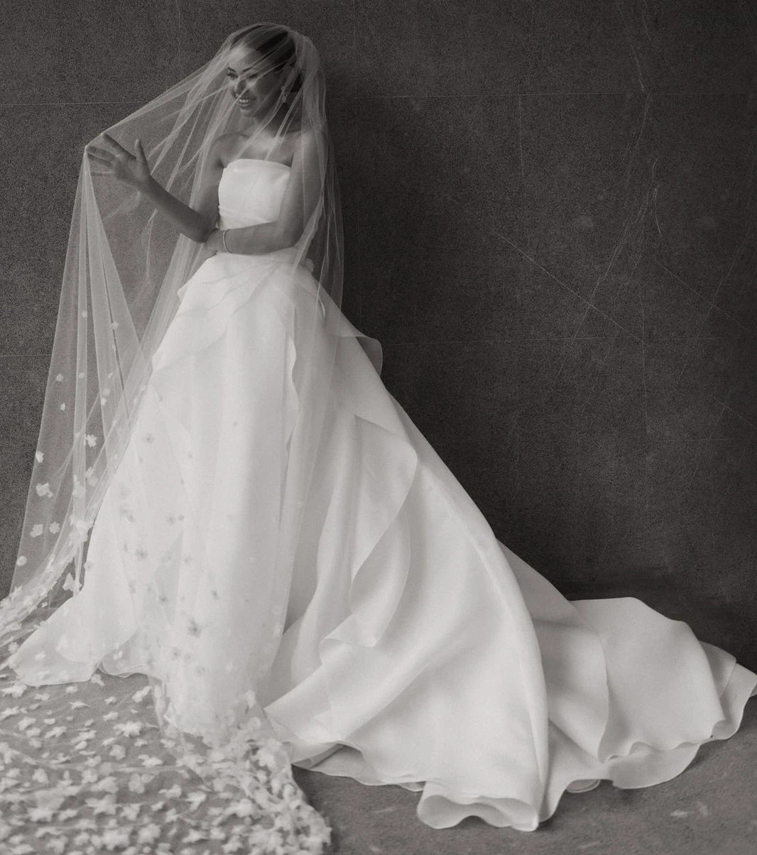 Сouple wearing a white gown and a blue suit